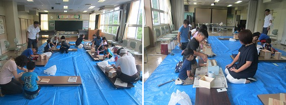 参加者たちが西川材を使って収納ラックを作っている様子の写真